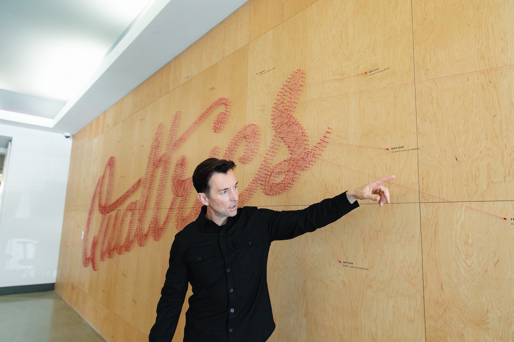 (Rachel Rydalch | The Salt Lake Tribune) Zig Serafin, Chief Executive Officer of Qualtrics, shows off a timeline wall at company headquarters on Tuesday, Feb. 1, 2022. The company recently celebrated 1 year of going public. 