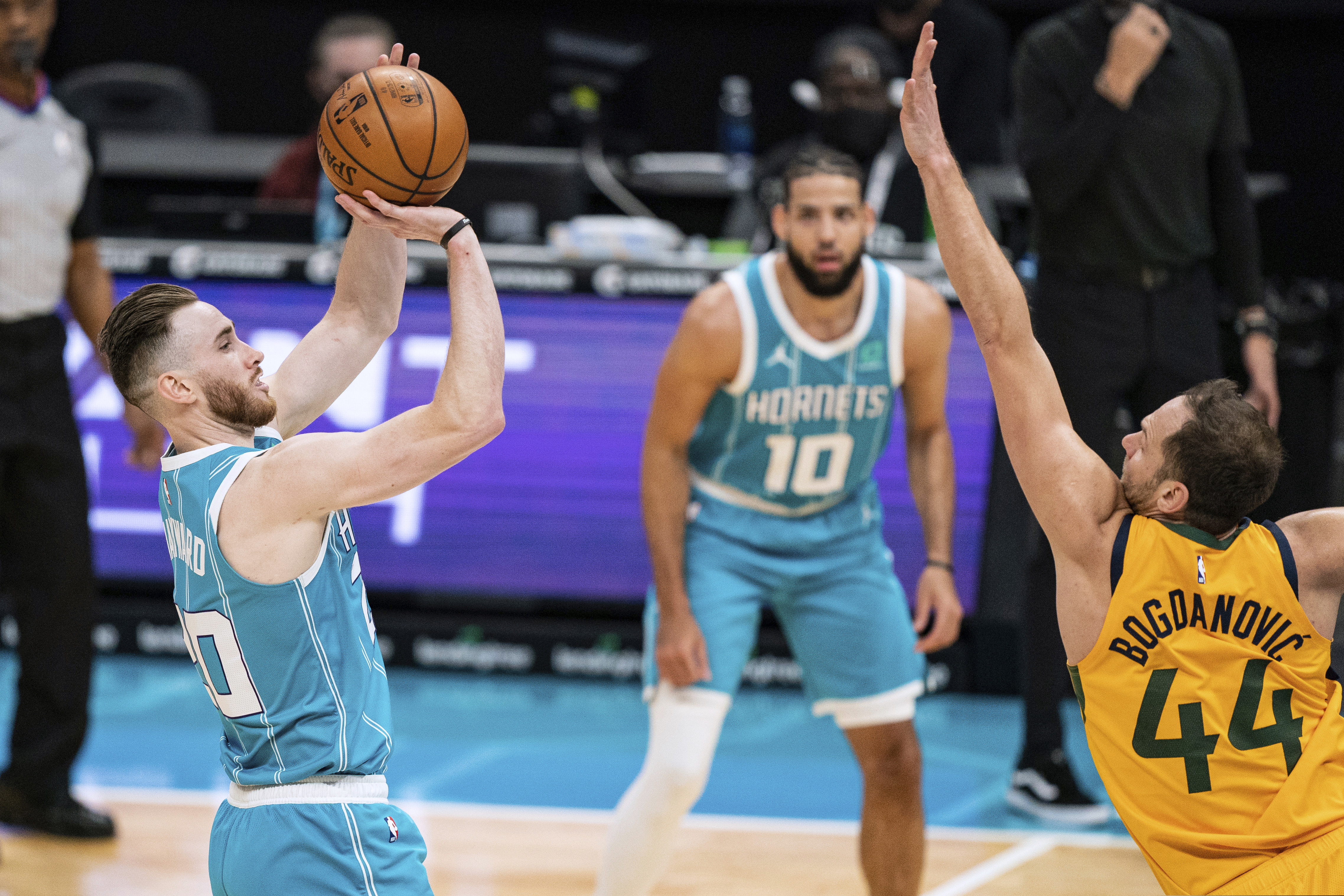 Charlotte Hornets forward Gordon Hayward (20) shoots over Utah Jazz forward Bojan Bogdanovic (44) during the first half of an NBA basketball game in Charlotte, N.C., Friday, Feb. 5, 2021. (AP Photo/Jacob Kupferman)