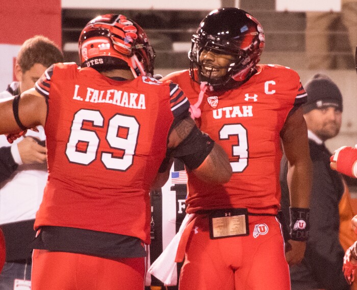 Utah Utes quarterback Troy Williams celebrates with Utah Utes offensive lineman Lo Falemaka (69) after scoring a touchdown on a quarterback keeper, in PAC-12 football action Utah Utes vs. Colorado Buffaloes at Rice-Eccles stadium, Saturday, November 25, 2017.