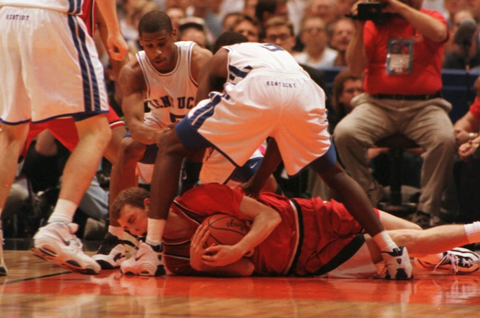 (Trent Nelson  |  Tribune file photo)  Utah's Drew Hansen tries to call a timeout under pressure from Kentucky's Wayne Turner and Allen Edwards in the 1998 championship game at the Alamodome in San Antonio, Texas.