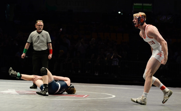 (Francisco Kjolseth  |  The Salt Lake Tribune)  Brayden Stevens of Brighton celebrates his win after leaving Brad Findley of Corner Canyon with a badly twisted leg in the Class 5A 152 weight class state wrestling championship match at the Utah Valley University UCCU Center on Thursday, Feb. 8, 2018.