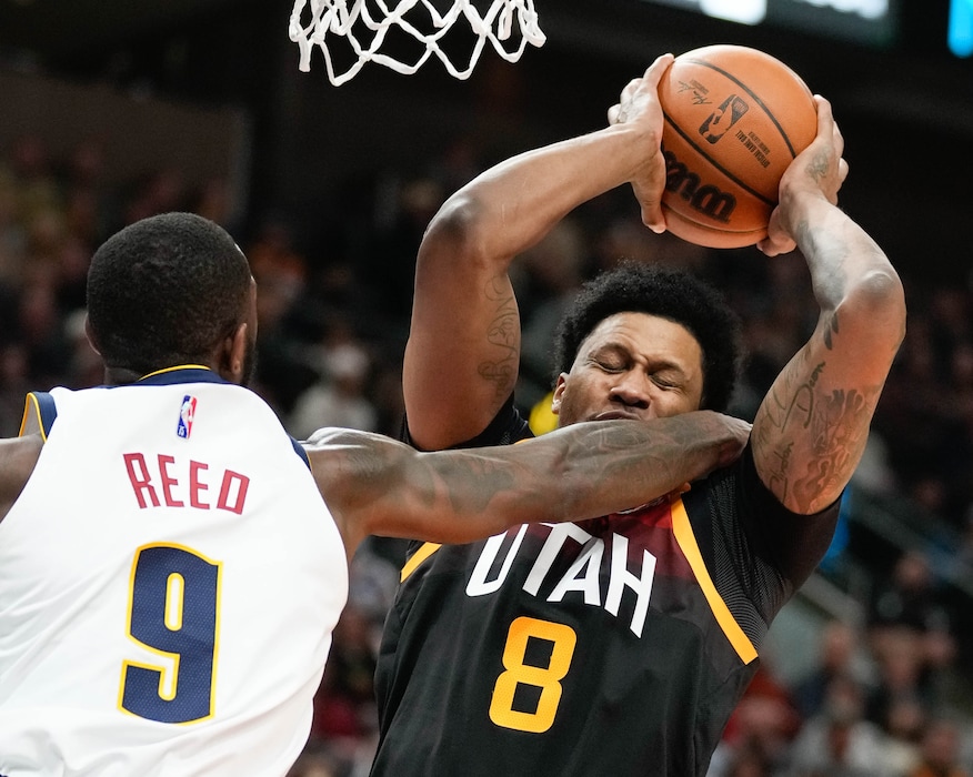 (Francisco Kjolseth | The Salt Lake Tribune) Denver Nuggets guard Davon Reed (9) lays in on Utah Jazz forward Rudy Gay (8) in NBA action between the Utah Jazz and the Denver Nuggets at Vivint Smart Home Arena in Salt Lake City, Wednesday, Feb. 2, 2022.