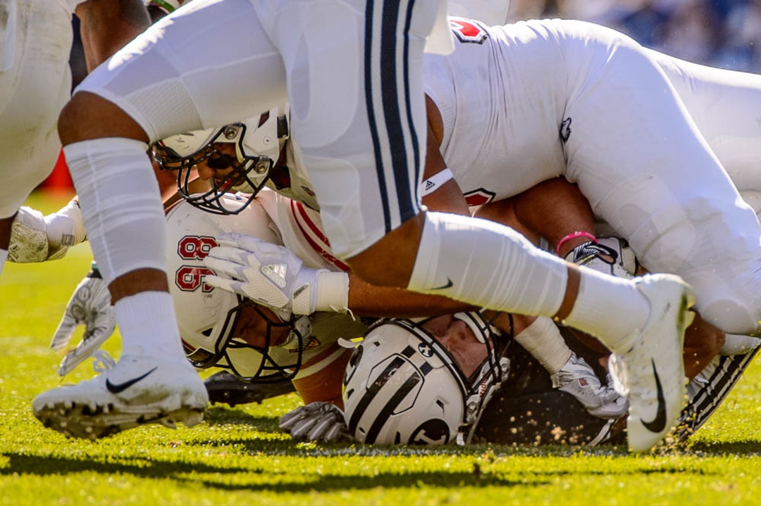 (Trent Nelson | The Salt Lake Tribune)  Brigham Young Cougars running back Matt Hadley (2) is tackled as BYU hosts Northern Illinois, NCAA football in Provo, Saturday Oct. 27, 2018.