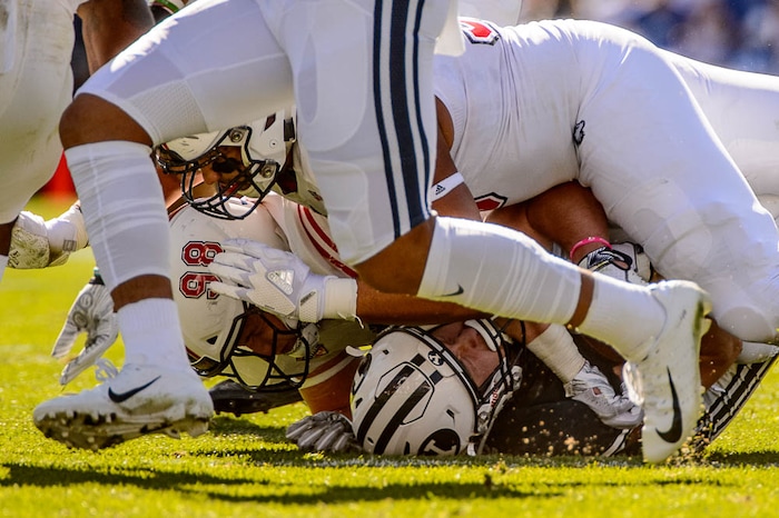 (Trent Nelson | The Salt Lake Tribune)  
Brigham Young Cougars running back Matt Hadley (2) is tackled as BYU hosts Northern Illinois, NCAA football in Provo, Saturday Oct. 27, 2018.