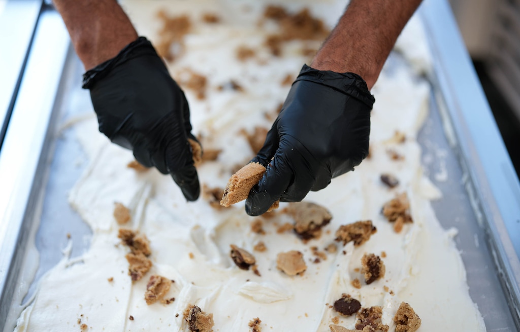 (Francisco Kjolseth | The Salt Lake Tribune) Mario Harper, owner of Blacksmith Ice Cream, begins a batch of milk and cookies ice cream, in Midvale on Thursday, Aug. 27, 2026. Blacksmith is currently partnering with Auntie Rae’s for the chocolate chip cookies folded into their creamy vanilla.