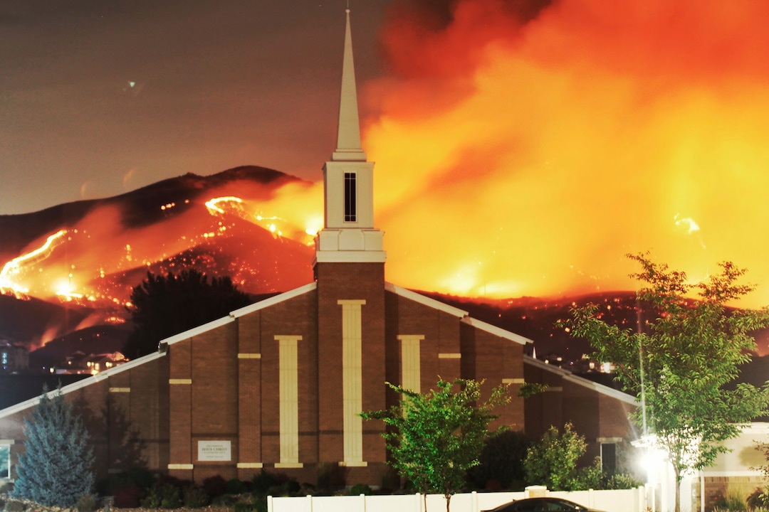 The Traverse Fire burns near homes in Lehi, Utah, Sunday, June 28, 2020. Officials say fireworks caused the wildfire and forced evacuations early Sunday morning. (Justin Reeves via AP)
