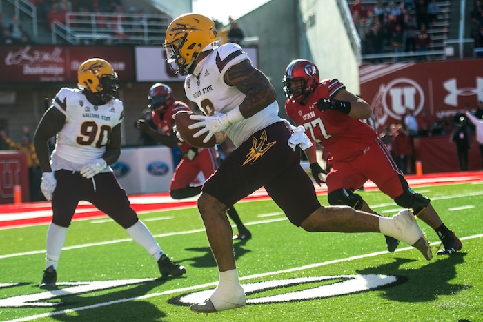 (Chris Detrick  |  The Salt Lake Tribune)  Arizona State Sun Devils tight end Jay Jay Wilson (9) scores a touchdown after intercepting the ball during the game at Rice-Eccles Stadium Saturday, October 21, 2017.  Arizona State Sun Devils defeated Utah Utes 30-10.