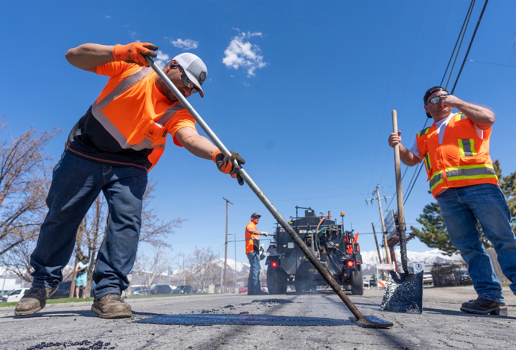 (Rick Egan | The Salt Lake Tribune) City workers repair potholes on Fremont Avenue after Mayor Erin Mendenhall announced the Pothole Palooza road repair effort Tuesday, April 11, 2023.