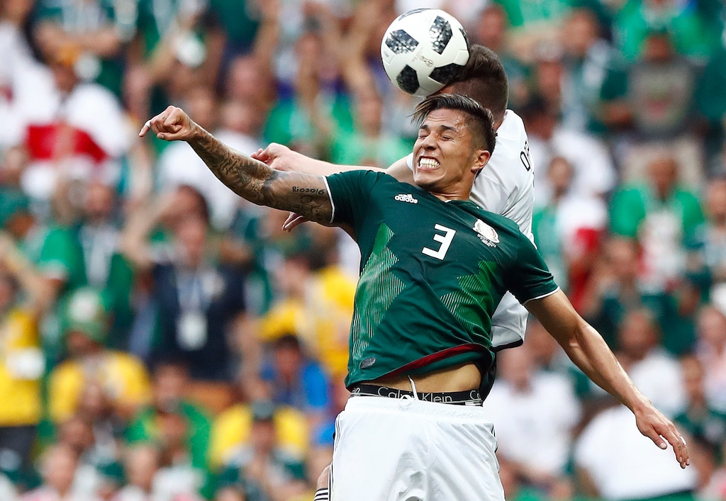 Mexico's Carlos Salcedo and Germany's Julian Draxler challenge for the ball during the group F match between Germany and Mexico at the 2018 soccer World Cup in the Luzhniki Stadium in Moscow, Russia, Sunday, June 17, 2018. (AP Photo/Matthias Schrader)