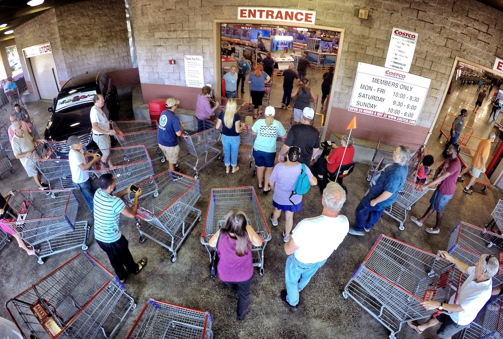 Shoppers crowd the entrance to the Costco store in Altamonte Springs, Fla. as central Floridians stock up on supplies ahead of the anticipated strike of Hurricane Matthew, Wednesday, Oct. 5, 2016. (Joe Burbank/Orlando Sentinel via AP) 