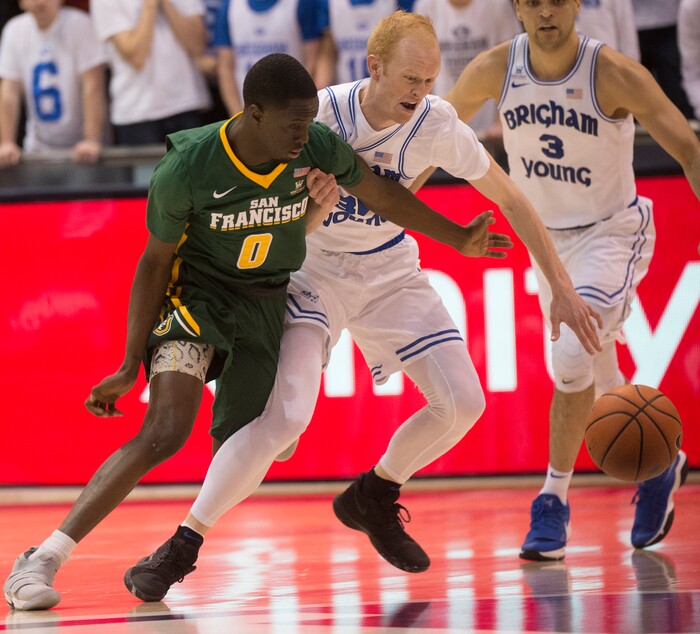 (Rick Egan  |  The Salt Lake Tribune)  Brigham Young Cougars guard TJ Haws (30) gets for the ball along with San Francisco Dons guard Souley Boum (0), in basketball action at the Marriott Center, Saturday, February 10, 2018.