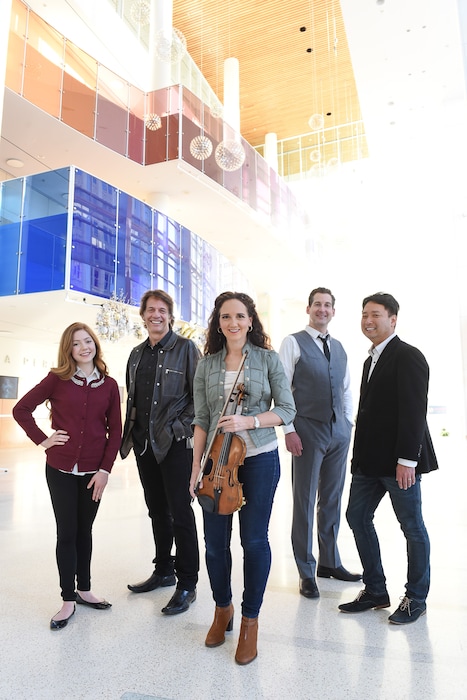 (Francisco Kjolseth | The Salt Lake Tribune) Kurt Bestor, center left, has not one, not two but four guests on his Christmas show this year, chosen by popular vote. From left, are soprano Lexi Walker, violinist Jenny Oaks Baker, tenor Dallyn Bayles and conductor Masa Fukuda.