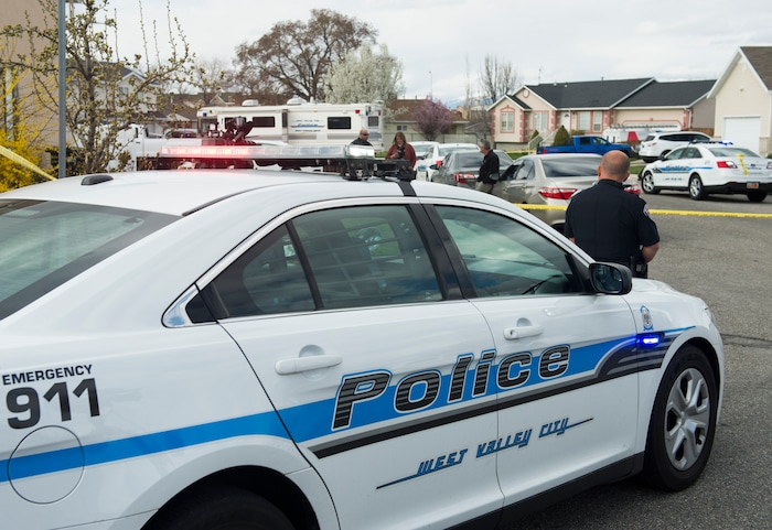 (Rick Egan | The Salt Lake Tribune) Police block the Janell Bay cul-de-sac, as Investigators from West Valley and Unified Police investigate an officer involved shooting, leaving the suspect dead, in West Valley City, Sunday, April 8, 2018.