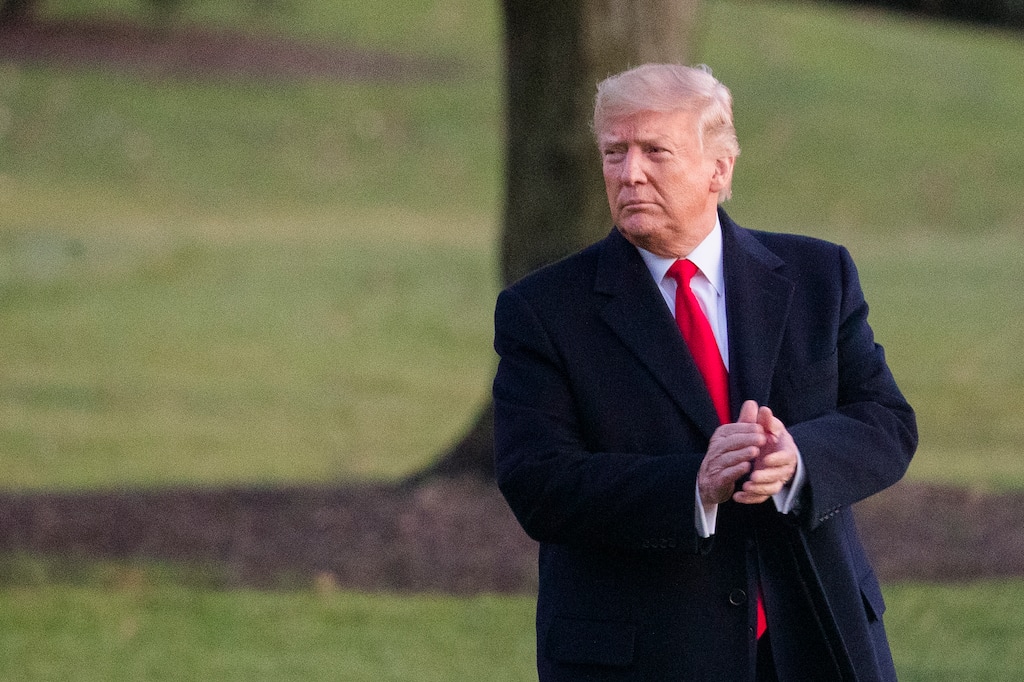 (Manuel Balce Ceneta | AP) President Donald Trump glances at the cheering White House visitors and claps his hands as as he leaves the White House for a campaign trip to Battle Creek, Mich., Wednesday, Dec. 18, 2019, in Washington.