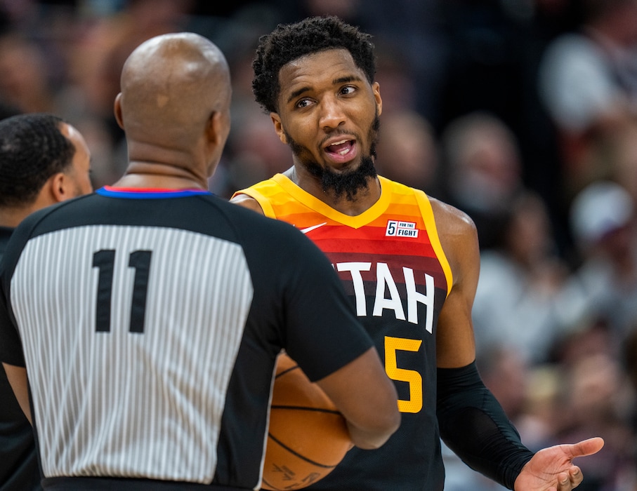 (Rick Egan | The Salt Lake Tribune) Utah Jazz guard Donovan Mitchell (45) chats with referee Derrick Collins (11), in NBA action between the Utah Jazz and the Chicago Bulls, at Vivint Arena, on Wednesday, March 16, 2022.  