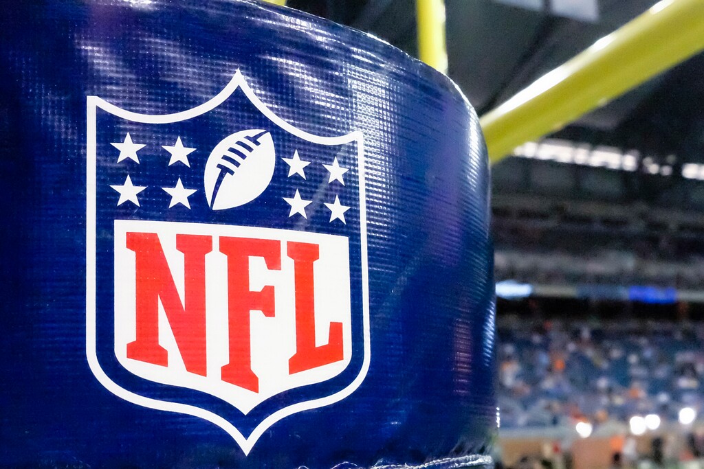FILE - This Aug. 9, 2014 file photo shows an NFL logo on a goal post padding before a preseason NFL football game between the Detroit Lions and the Cleveland Browns at Ford Field in Detroit. A federal judge overseeing the NFL’s $1 billion concussion settlement with former players says she’s concerned they're being targeted by claims service providers, lenders and other groups seeking a share of the money. At a hearing in Philadelphia on Tuesday, Sept. 19, 2017, U.S. District Judge Anita Brody will hear allegations unscrupulous third-party providers have been taking advantage of players with significant brain damage. (AP Photo/Rick Osentoski, File)