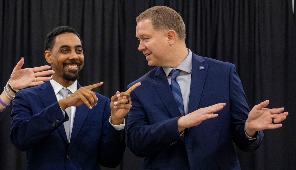 (Rick Egan | The Salt Lake Tribune)  The new coaches try to learn the Aggie fight song, during a news conference introducing Wesley Brooks and Jerrod Calhoun as the Aggies’ new  women’s and men’s basketball head coaches, at Utah State University, in Logan, on Tuesday, April 2, 2024.