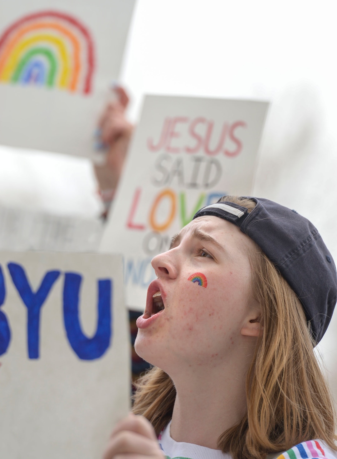 (Leah Hogsten  |  The Salt Lake Tribune) Kate Lunnen rallies with hundreds of other students and supporters Friday. Brigham Young University LGBTQ students took their concerns about the schoolÕs policy reversal regarding romantic behavior by same-sex couples to The Church of Jesus Christ of Latter-day Saints office building, Mar. 6, 2020. Despite removing the section on Òhomosexual behaviorÓ from BYU Honor Code last month, The LDS Church has clarified for the first time that same-sex romantic behavior is still Ònot compatibleÓ with the rules at BYU.