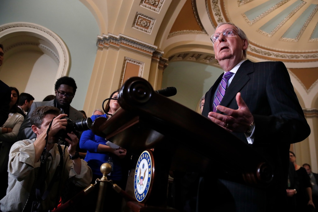 Senate Majority Leader Mitch McConnell of Ky., right, speaks to the media, Tuesday, July 24, 2018, on Capitol Hill in Washington. (AP Photo/Jacquelyn Martin)