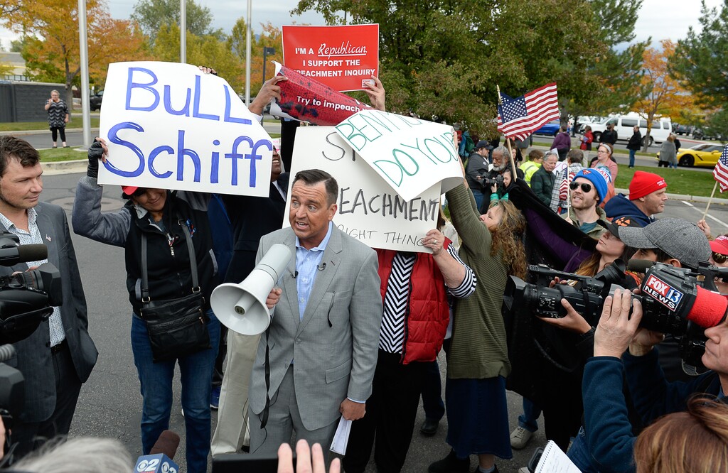 (Francisco Kjolseth | Tribune file photo)  Former Utah House of Representatives speaker Greg Hughes speaks to President Trump supporters as two competing rallies spar near U.S. Rep. Ben McAdams' office in West Jordan, one seeking to support McAdams and one to criticize him for supporting the impeachment inquiry of President Donald Trump on Wednesday, Oct. 9, 2019.