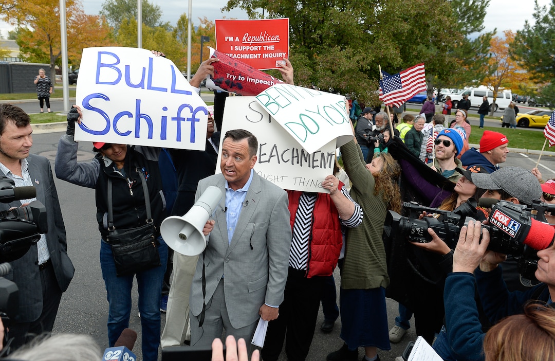 (Francisco Kjolseth | The Salt Lake Tribune)  Former Utah House of Representatives speaker Greg Hughes speaks to President Trump supporters as two competing rallies spar near U.S. Rep. Ben McAdams' office in West Jordan, one seeking to support McAdams and one to criticize him for supporting the impeachment inquiry of President Donald Trump on Wednesday, Oct. 9, 2019.