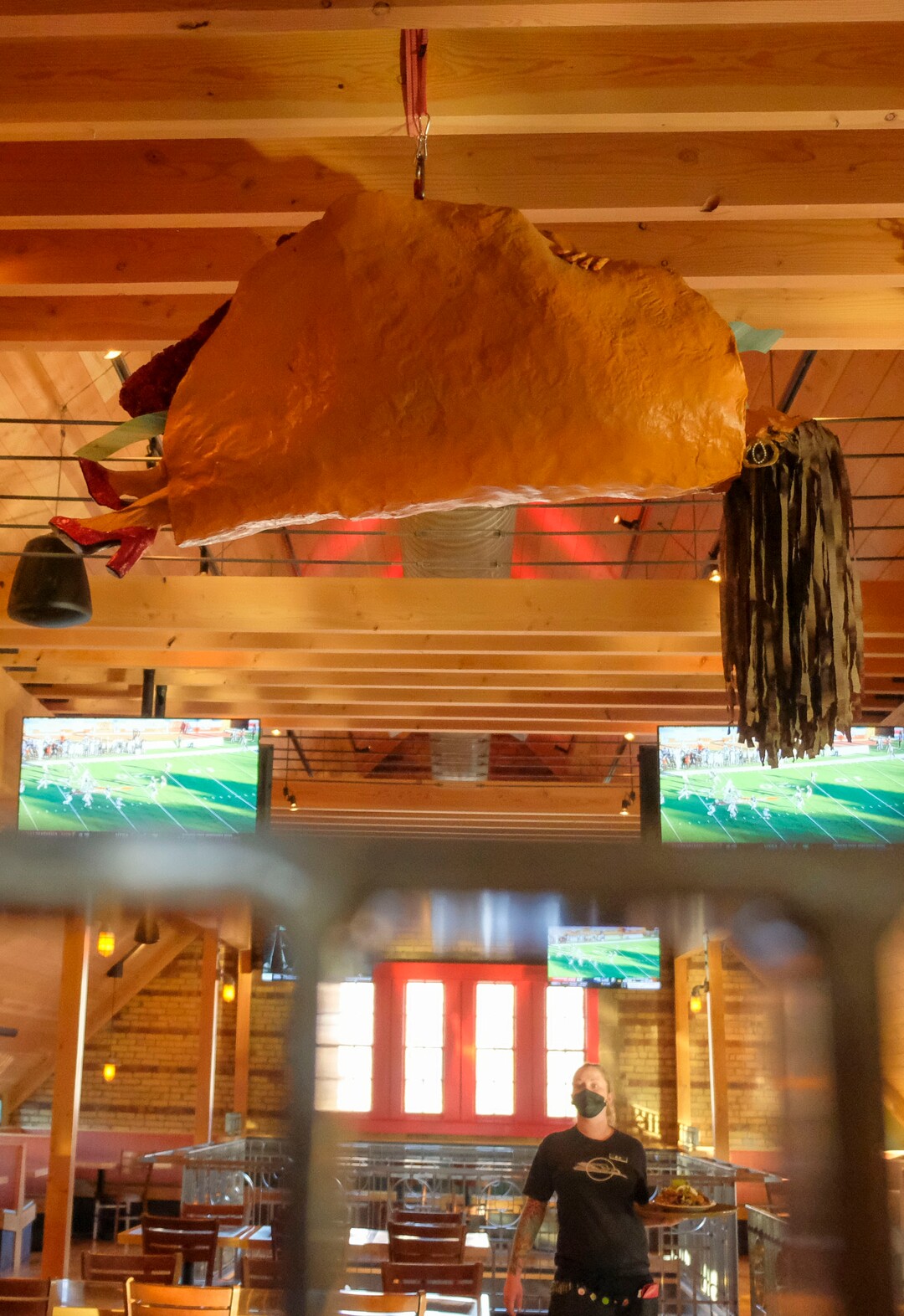 (Leah Hogsten  |  The Salt Lake Tribune) Rio Grande Cafe's "Taco Lady" hangs from the ceiling on the second level. Salt Lake City's popular Rio Grande Cafe Ñ which has been closed since March due to the pandemic and the earthquake Ñ has moved to its new location near the University of Utah on 1300 East.