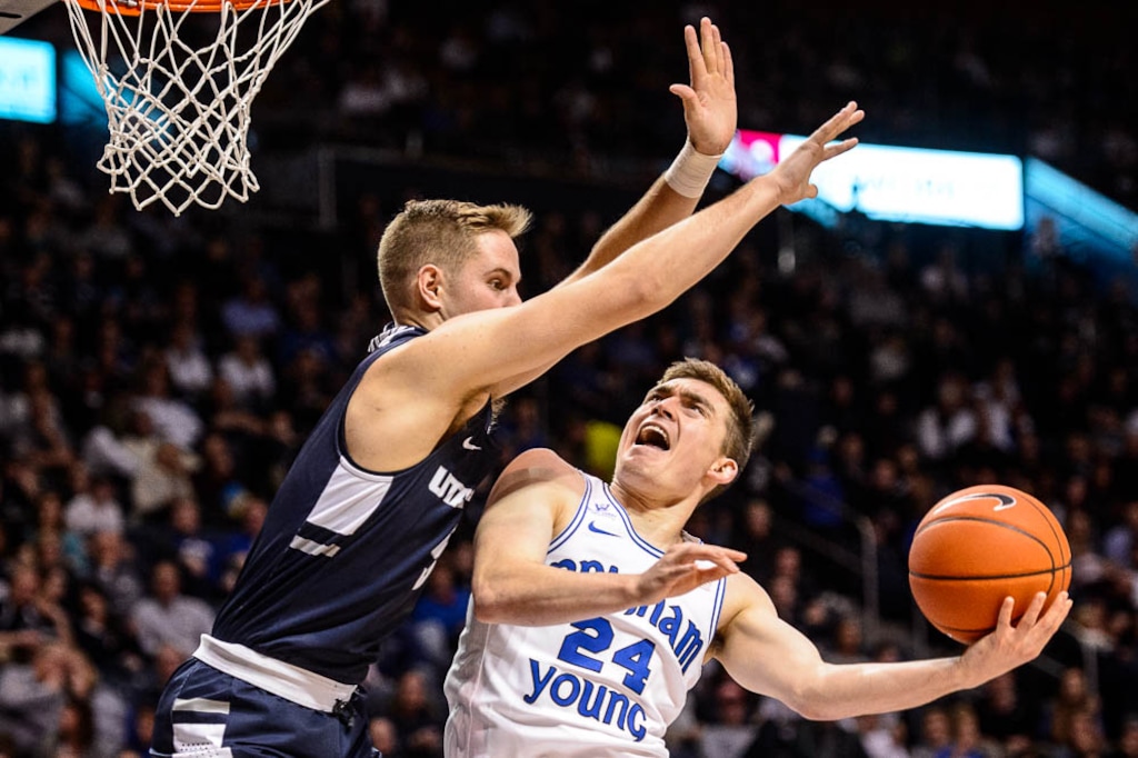 (Trent Nelson | The Salt Lake Tribune)  Brigham Young Cougars guard McKay Cannon (24) shoots, defended by Utah State Aggies guard Sam Merrill (5) as BYU hosts Utah State, NCAA basketball in Provo on Wednesday Dec. 5, 2018.