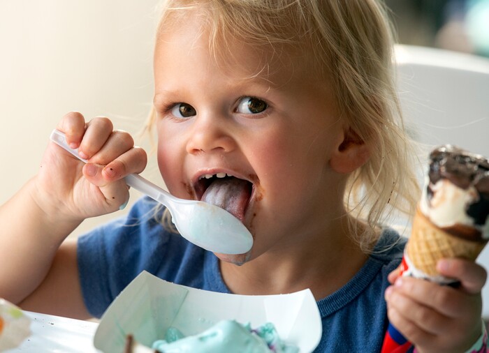 (Rick Egan  |  The Salt Lake Tribune)    
Evie Collier, 2, from Saratoga Springs eats ice cream  at the all you can eat Ice Cream Festival at the Utah State Fair Monday, Sept. 9, 2019. Dairy West farmers are donating all proceeds from the festival to the Utah Food Bank.