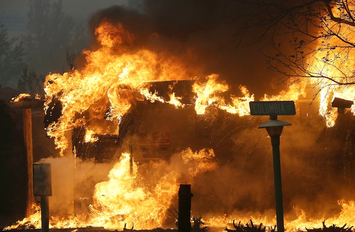 A structure at Journey's End mobile home park burns in Santa Rosa, Calif., Monday, Oct. 9, 2017. Wildfires whipped by powerful winds swept through Northern California sending residents on a headlong flight to safety through smoke and flames as homes burned. (AP Photo/Jeff Chiu)