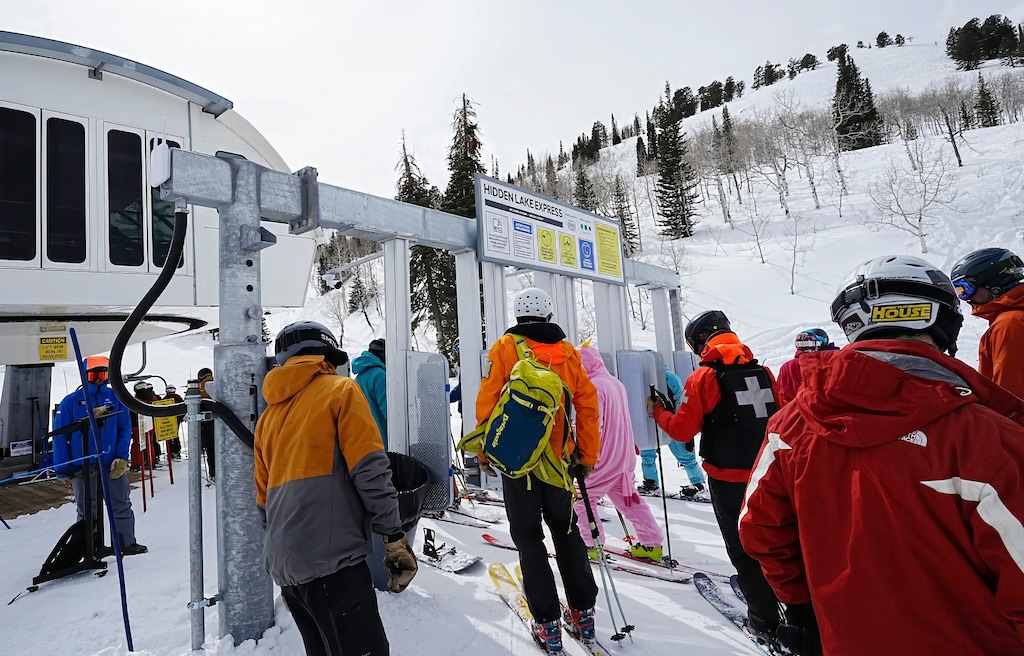 (Francisco Kjolseth  | The Salt Lake Tribune) Skiers and snowboarders line up for the Hidden Lake Express lift at Powder Mountain on Friday, March 21, 2025. Skiers and snowboarders spent less overall during Utah's 2024-25 season than in the previous three. Locals, however, spent more.