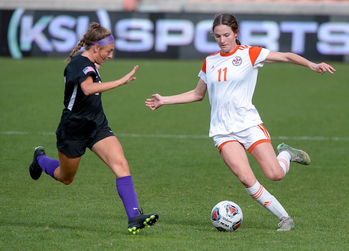 (Chris Samuels | The Salt Lake Tribune) Skyridge Kylie Olsen (11) kicks the ball against Riverton in the 6A girls’ soccer state championships at Rio Tinto Stadium in Sandy, Friday, Oct. 22, 2021.