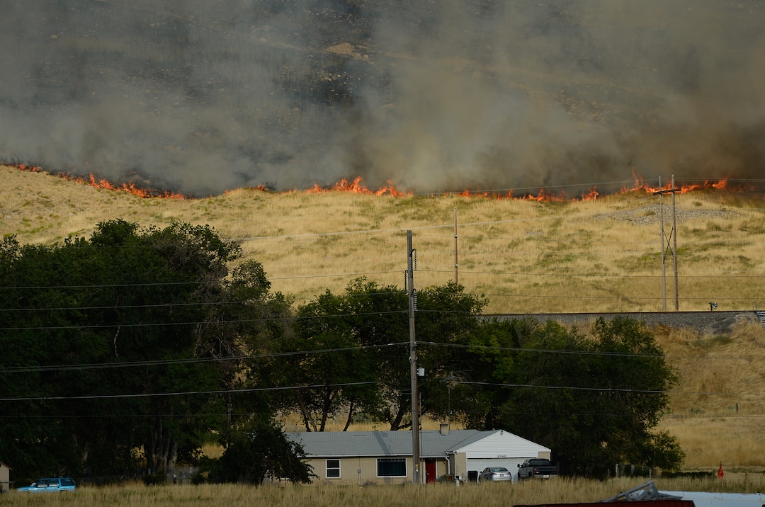 (Francisco Kjolseth  |  The Salt Lake Tribune)  Crews battle a grass fire in Tooele county being dubbed the Green Ravine fire as it burns on Tuesday, Sept. 3, 2019.