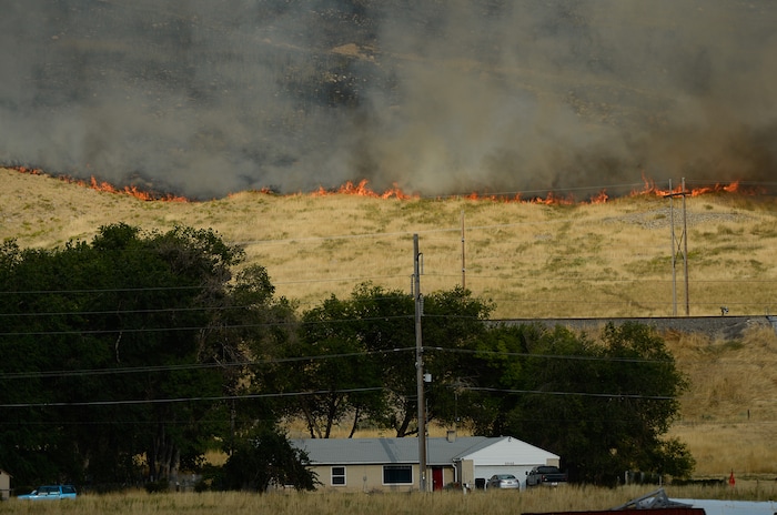 (Francisco Kjolseth  |  The Salt Lake Tribune)  Crews battle a grass fire in Tooele county being dubbed the Green Ravine fire as it burns on Tuesday, Sept. 3, 2019.