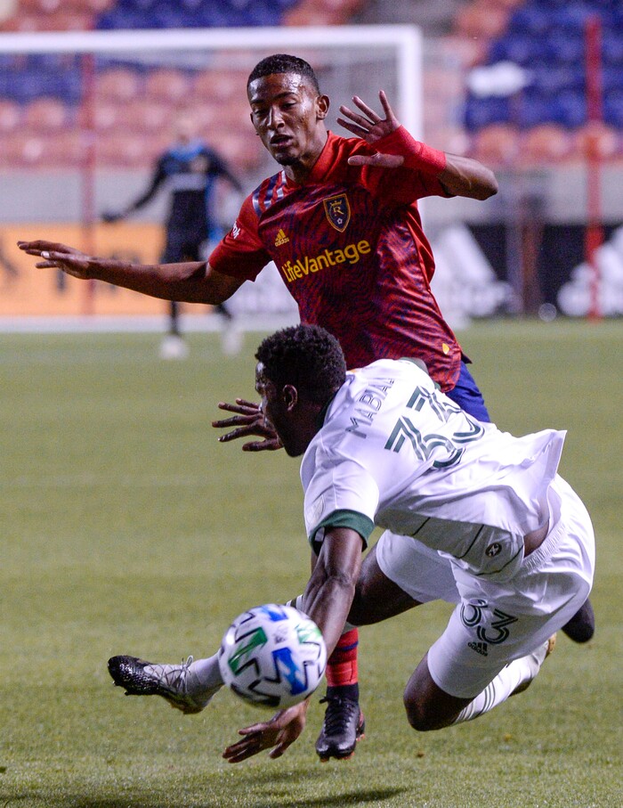 (Leah Hogsten  |  The Salt Lake Tribune) Real Salt Lake forward Douglas Martinez (12) and Portland Timbers defender Larrys Mabiala (33) as Real Salt Lake hosts the Portland Timbers, Oct. 14, 2020.