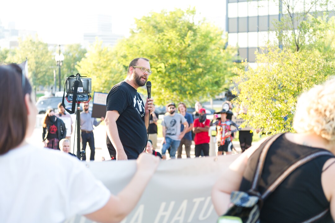 (Alex Gallivan | Special to the Tribune) David Newlin leads the crowd in chants at an Emergency Rally hosted by Utah Against Police Brutality, in response to the arrest of U of U nurse Alex Wubbels. Wubbels was arrested by SLCPD Detective Jeff Payne after she refused to take blood from an unconscious patient, which is against hospital policy.