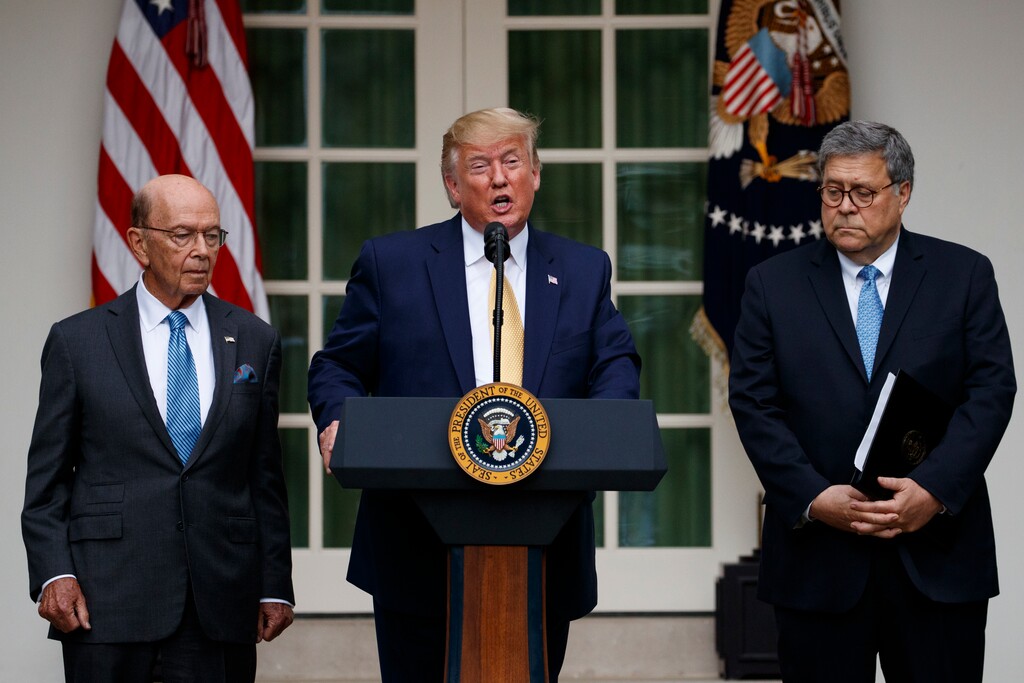 President Donald Trump, joined by Commerce Secretary Wilbur Ross, left, and Attorney General William Barr, speaks during an event about the census in the Rose Garden at the White House in Washington, Thursday, July 11, 2019. (AP Photo/Carolyn Kaster)