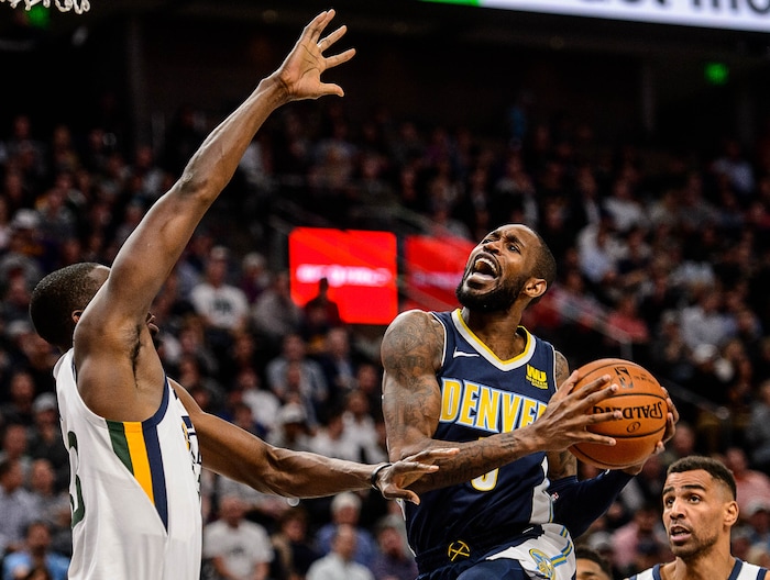 (Trent Nelson | The Salt Lake Tribune)  Denver Nuggets guard Will Barton (5) defended by Utah Jazz forward Ekpe Udoh (33) as the Utah Jazz host the Denver Nuggets, NBA basketball in Salt Lake City, Wednesday October 18, 2017.