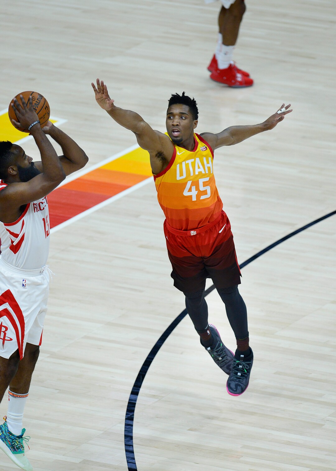 (Scott Sommerdorf | The Salt Lake Tribune)Utah Jazz guard Donovan Mitchell (45) tries to disrupt the 3-point shot of Houston Rockets guard James Harden (13)  during first half play. The Houston Rockets led the Utah Jazz 70-40 at the half of game 3, Friday, May 4, 2018.