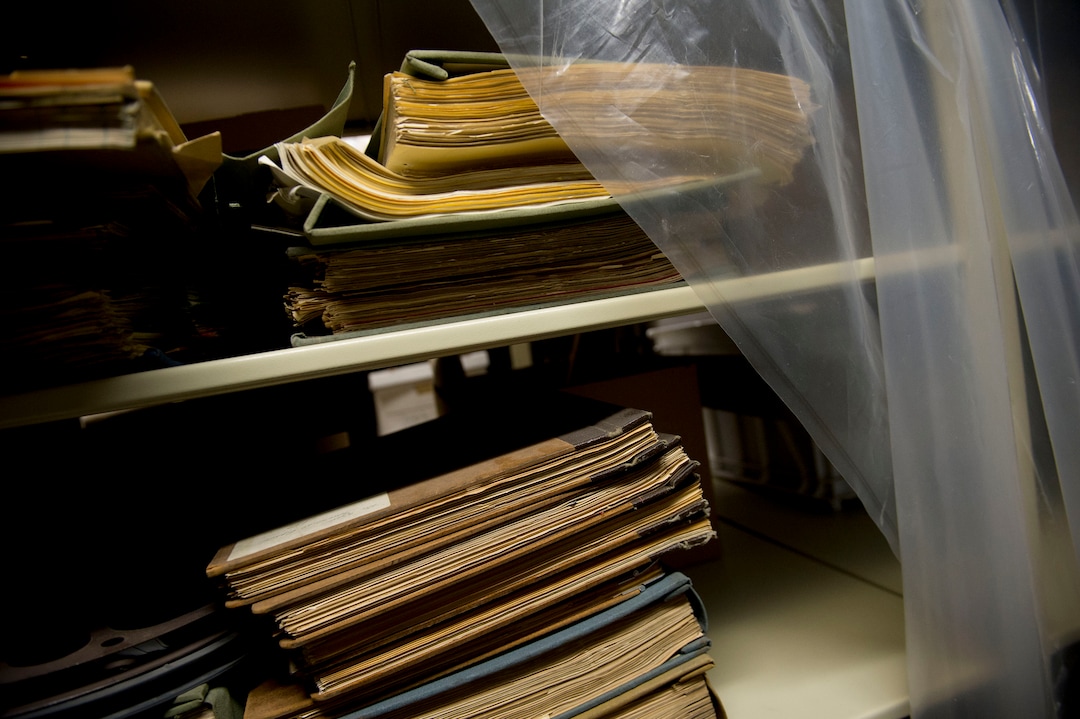 (Jeremy Harmon  |  The Salt Lake Tribune) Historic documents sit on a plastic covered shelf in the basement of the Rio Grande Depot, home of the Utah state historical offices, on Feb. 15, 2018. The shelves have to be covered in plastic because of water leaks in the room.