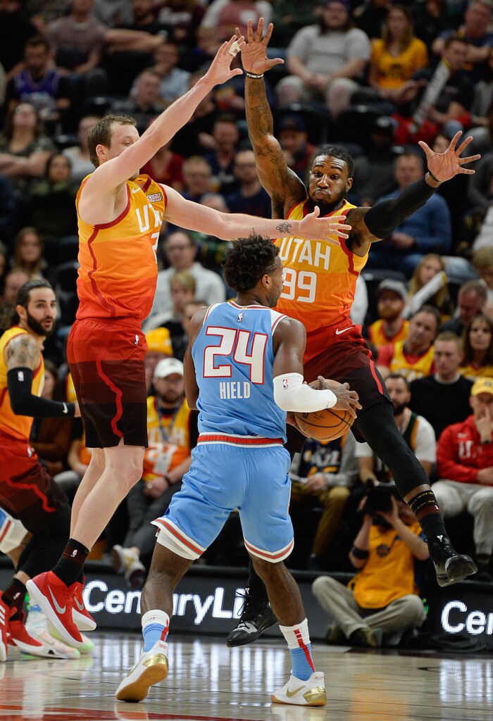 (Francisco Kjolseth  |  The Salt Lake Tribune)  Sacramento Kings guard Buddy Hield (24) meets a wall from Utah Jazz forward Joe Ingles (2) and Utah Jazz forward Jae Crowder (99) in game action in the NBA game at Vivint Smart Home Arena Wed., Nov. 21, 2018, in Salt Lake City.