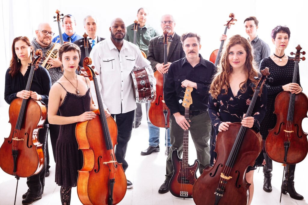(Jason Quigley) Members of the Portland Cello Project — from left: Karen Schulz-Harmon, Farnell Newton, Skip vonKuske, Sage Coy, Gideon Freudmann, Tyrone Hendrix, Kevin Jackson, Collin Oldham, JP Downer, Lauren McShane, Julian Kosanovic and Diane Chaplin — which is scheduled to perform Dec. 14, 2024, at The State Room in Salt Lake City.