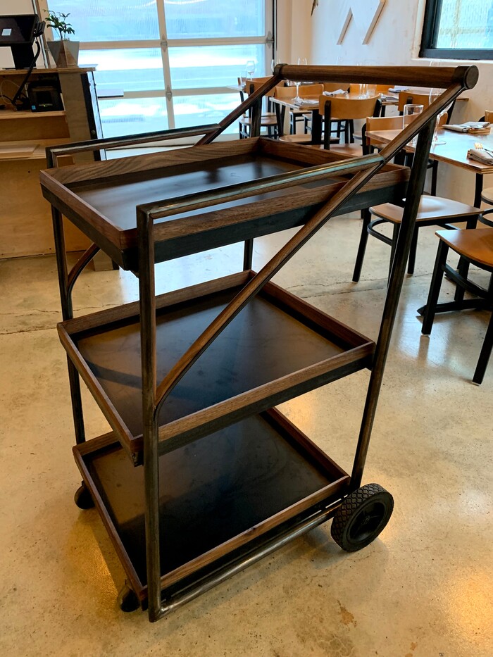 (Courtesy photo of SLC Eatery) Guests guests select small plates from a tiered metal cart at the new SLC Eatery.