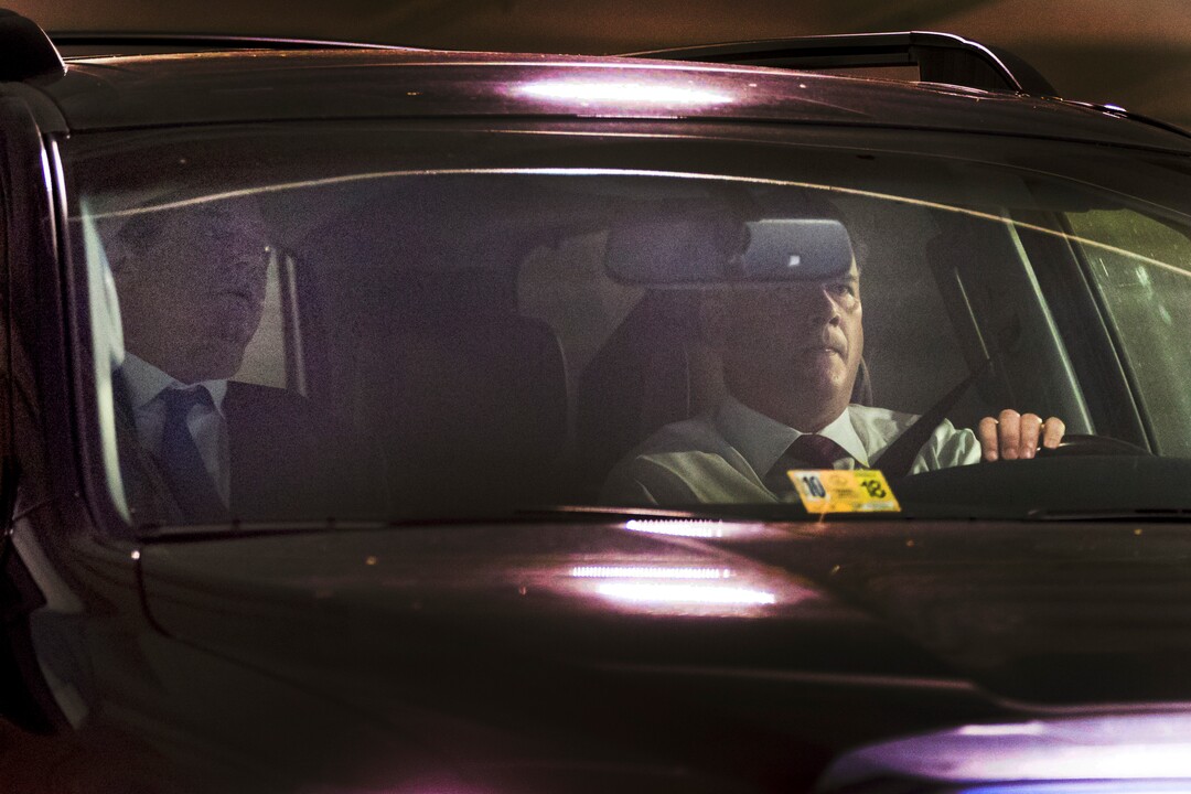 Former Trump Campaign Chairman Paul Manafort, left, leaves his home in Alexandria, Va., Monday, Oct. 30, 2017, in Washington.  Manafort, and a former business associate, Rick Gates, have been told to surrender to federal authorities Monday, according to reports and a person familiar with the matter. (AP Photo/Andrew Harnik)