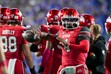 (Bethany Baker  |  The Salt Lake Tribune) Utah Utes quarterback Devon Dampier (4) practices passing during a timeout during the game between the BYU Cougars and the Utah Utes in Provo on Saturday, Oct. 18, 2025.