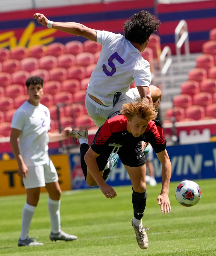 (Francisco Kjolseth | The Salt Lake Tribune) Alta’s Preston Ludlow (9) collides with Lehi’s Anthony Bustos (5) during their 5A State Soccer Championship title game at Rio Tinto Stadium, Wednesday, May 25, 2022. Alta defeated Lehi in shootout 3-1.