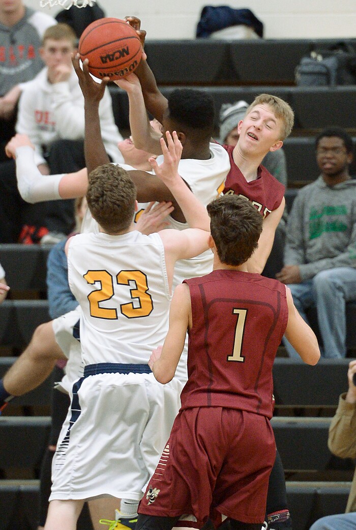 (Leah Hogsten  |  The Salt Lake Tribune) Juab's Kollin Robertson tries to stop Summit's Jalexus Gilson. Juab High School boys' basketball team defeated Summit Academy 61-58 during their 3A State tournament game in Heber  Saturday, Feb. 16, 2018.
