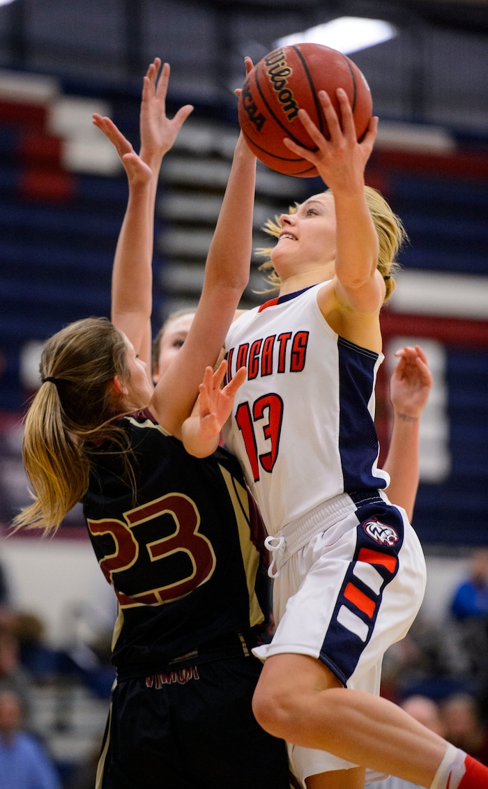 (Trent Nelson  |  The Salt Lake Tribune)  Woods Cross's Sara Noel shoots over Viewmont's Karli Gunnell as Woods Cross hosts Viewpoint High School girls' basketball, Wednesday, January 24, 2018.