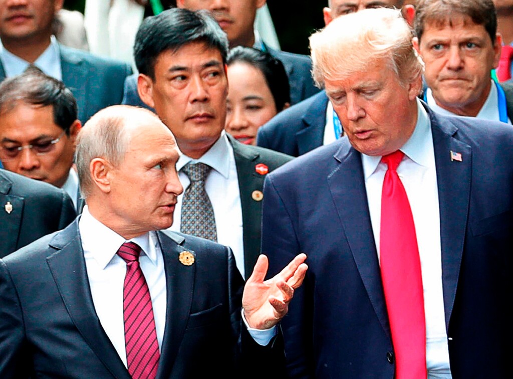 (Mikhail Klimentyev | Sputnik | Kremlin Pool Photo | The Associated Press) In this Nov. 11, 2017, file photo,  President Donald Trump, right, and Russia President Vladimir Putin talk during the family photo session at the APEC Summit in Danang. The Trump administration is opening the door to a potential White House meeting between Trump and Putin. It would be the first time Putin has been at the White House in more than a decade and come at a time of rising tensions between the two global powers.