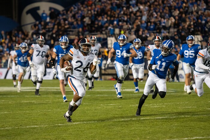(Trevor Christensen | Special to The Tribune) Virginia's Devin Darrington runs the ball against Brigham Young University during the second half at LaVell Edwards Stadium on Saturday, Oct. 30, 2021, in Provo.