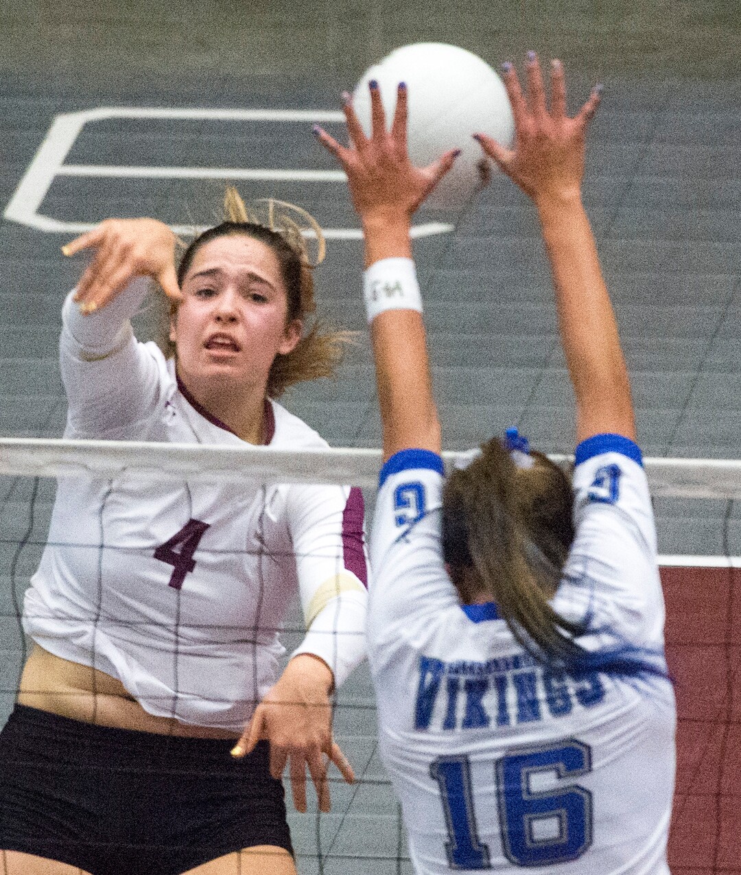 Rick Egan  |  The Salt Lake TribuneLone Peak Knights KacieÊHuntsman (4) hits the ball, as Kazna Tarawhiti (16)  Pleasant Grove defends, in 5A championship volleyball action, Pleasant Grove vs. Lone Peak, in Orem, November 5, 2016.